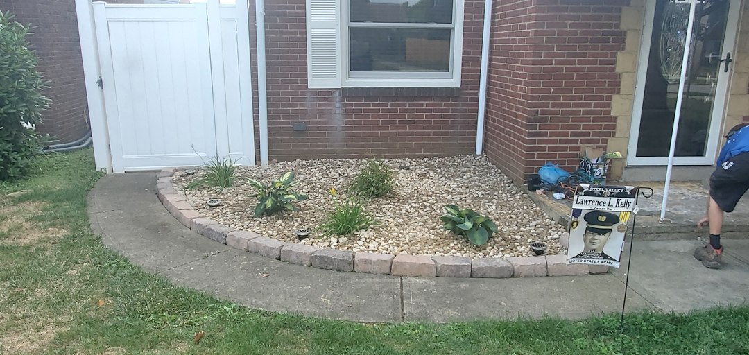 Decorative stone installation and new stone border with plant removal and replanting in Munhall, Pa